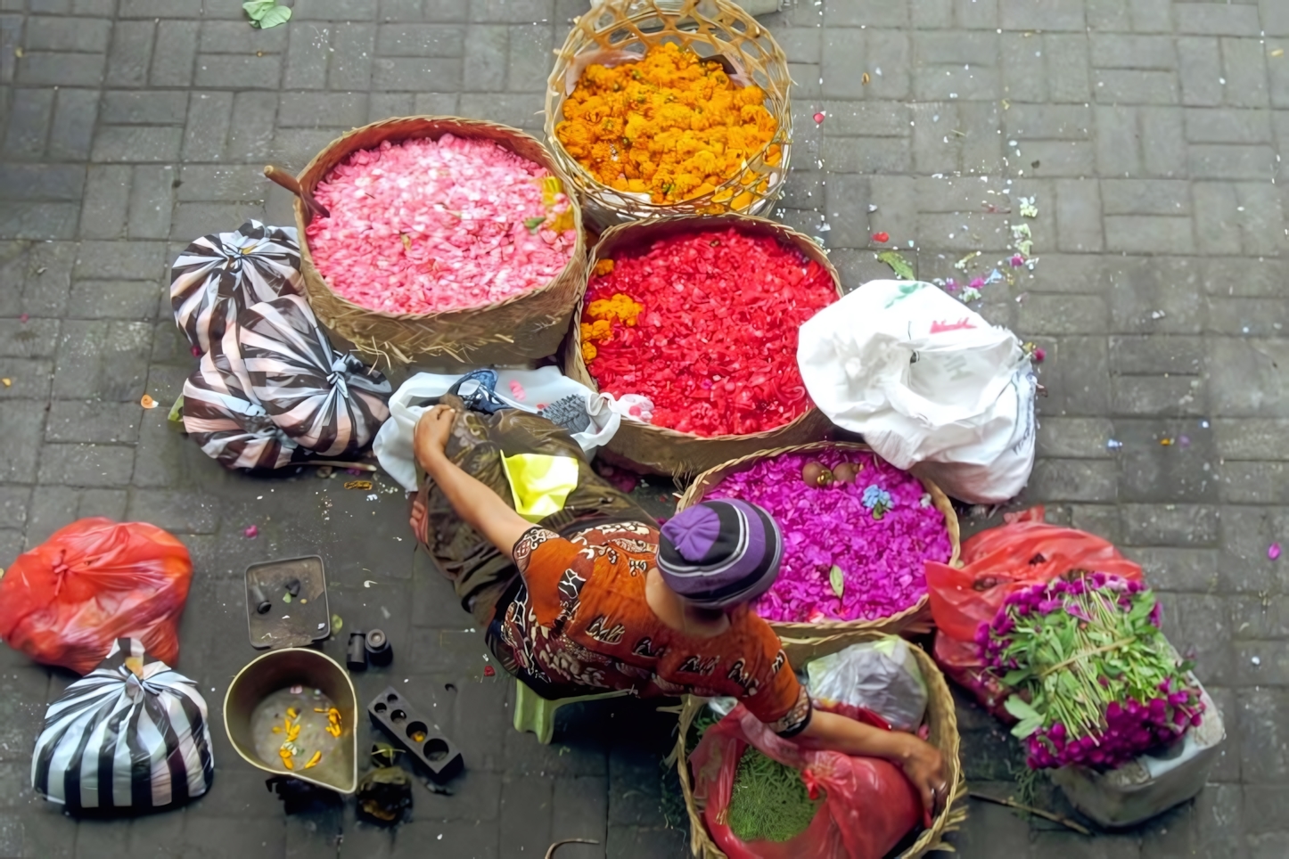 Woman selling flower petals at Ubud Market, Bali